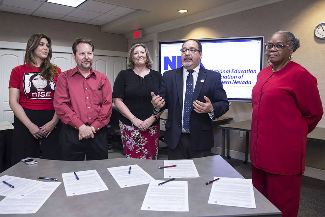 Mercedes Krause, left, Chet Miller, Carmen Andrews, Ruben Murillo and Patricia Stevens officially announce a new teachers union for Clark County educators called the National Education Association ...