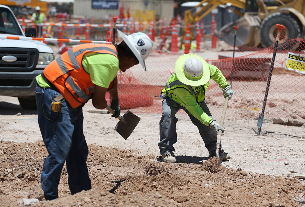 Workers shovel dirt on the construction site for the future Raiders stadium in Las Vegas, Thursday, June 28, 2018. Erik Verduzco Las Vegas Review-Journal @Erik_Verduzco
