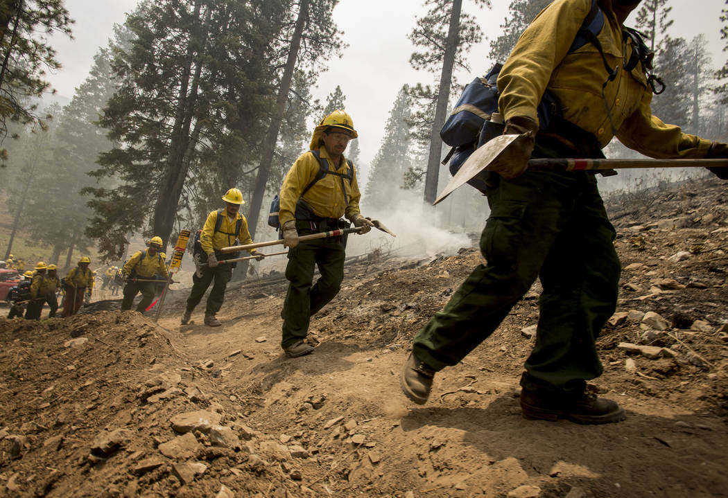 A Type 2 firefighters from Sequoia National Forest heads back to fight the Carpenter 1 Fire after a break at the Rainbow subdivision in Mt. Charleston on Tuesday, July 9, 2013. (Jeff Scheid/Las V ...