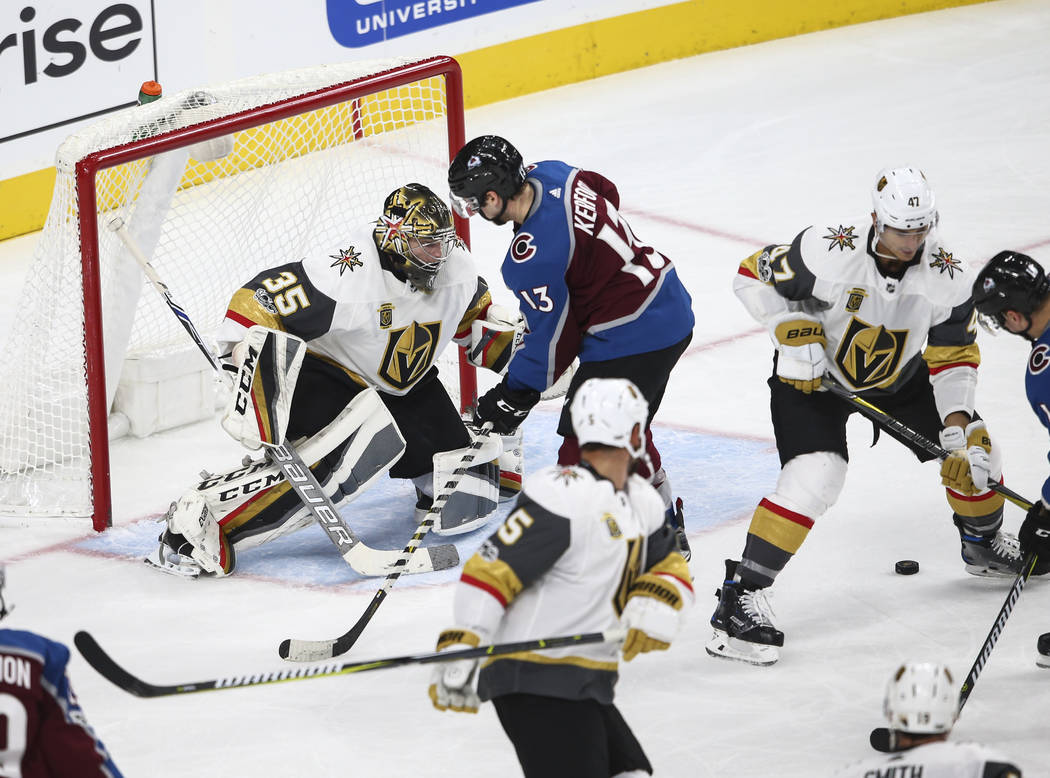 Golden Knights' Oscar Dansk (35) defends as Colorado Avalanche attacks during an NHL hockey game at T-Mobile Arena in Las Vegas on Friday, Oct. 27, 2017. Chase Stevens Las Vegas Review-Journal @cs ...