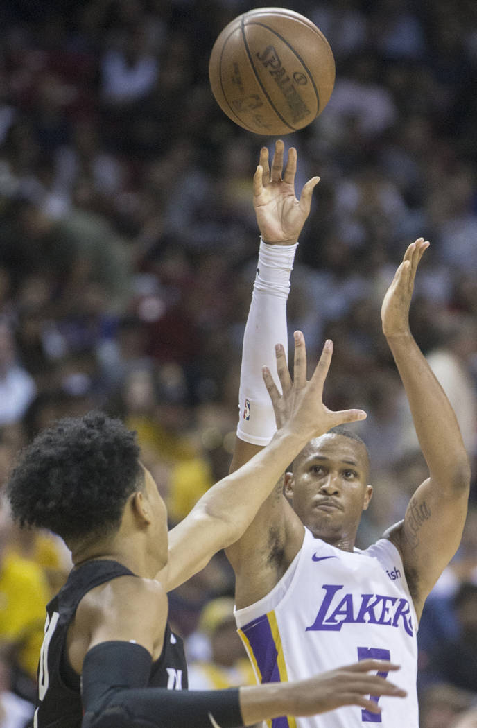 Los Angeles Lakers guard Demarcus Holland (7) shoots over Portland Trail Blazers guard Anfernee Simons (24) in the fourth quarter during the NBA Summer League finals on Tuesday, July 17, 2018, at ...