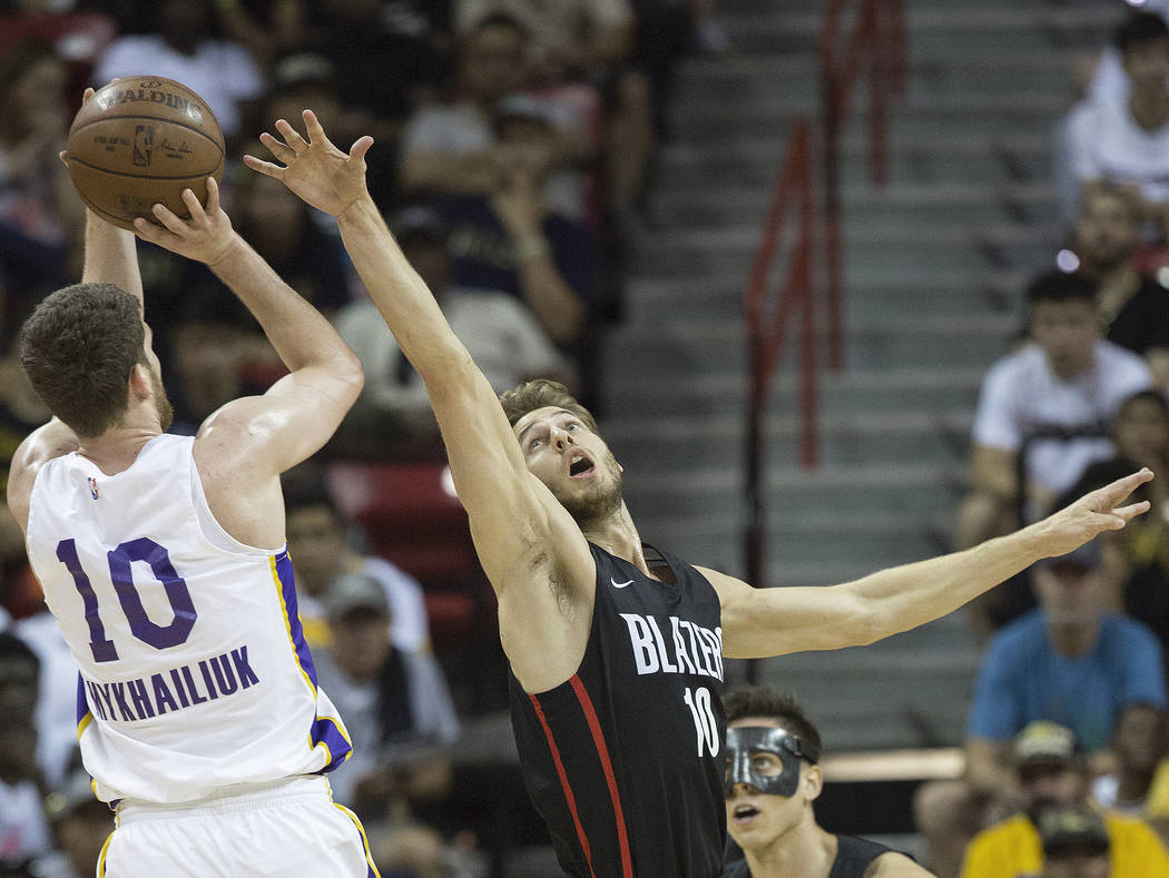 Portland Trail Blazers forward Jake Layman (10) defends Los Angeles Lakers forward Sviatoslav Mykhailiuk (10) in the first quarter during the NBA Summer League finals on Tuesday, July 17, 2018, at ...