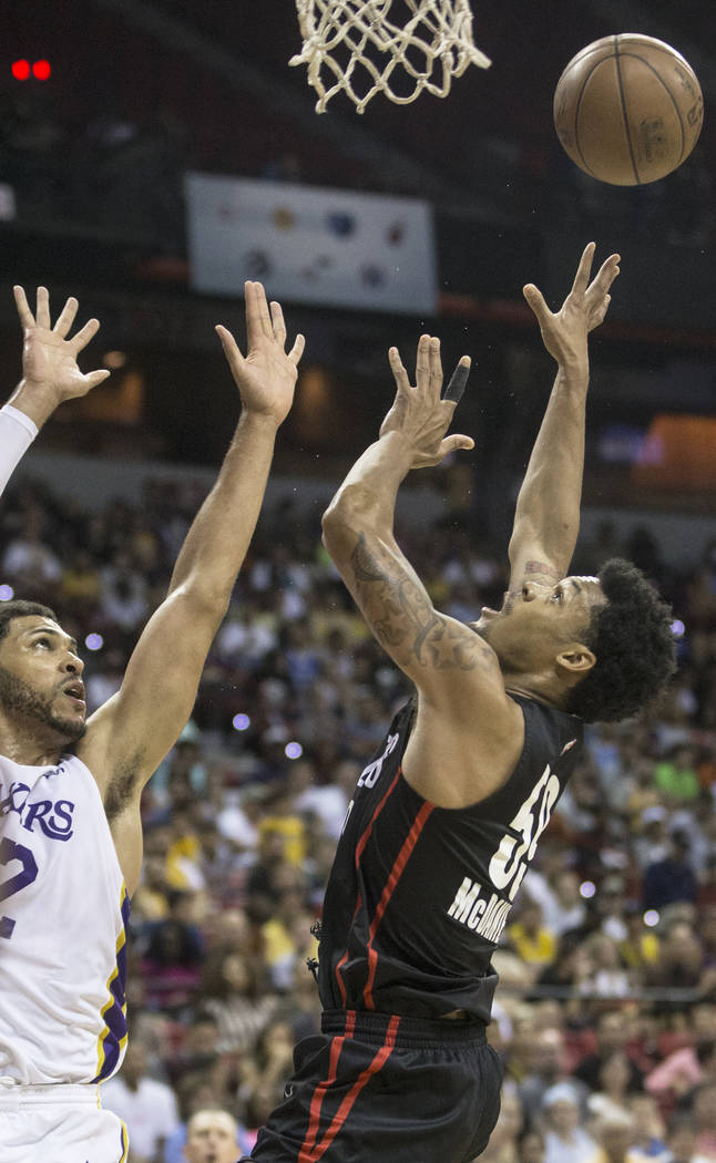 Portland Trail Blazers guard K.J. McDaniels (59) drives past Los Angeles Lakers forward Jeff Ayres (12) in the second quarter during the NBA Summer League finals on Tuesday, July 17, 2018, at the ...