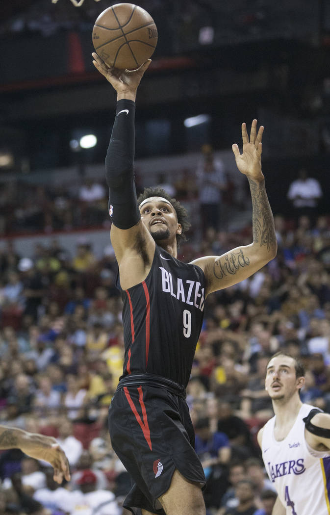 Portland Trail Blazers guard Gary Trent Jr. (9) drives past Los Angeles Lakers guard Alex Caruso (4) in the fourth quarter during the NBA Summer League finals on Tuesday, July 17, 2018, at the Tho ...