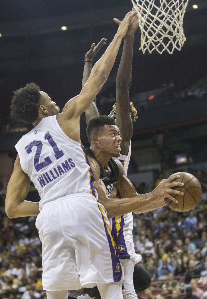 Portland Trail Blazers guard Wade Baldwin IV (2) drives past Los Angeles Lakers defenders Johnathan Williams (21) and Isaac Bonga (17) in the fourth quarter during the NBA Summer League finals on ...
