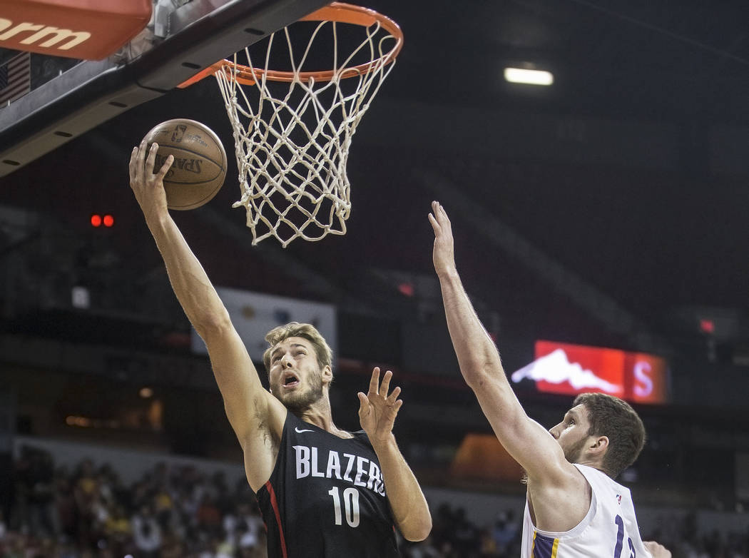 Portland Trail Blazers forward Jake Layman (10) drives past Los Angeles Lakers forward Sviatoslav Mykhailiuk (10) in the first quarter during the NBA Summer League finals on Tuesday, July 17, 2018 ...