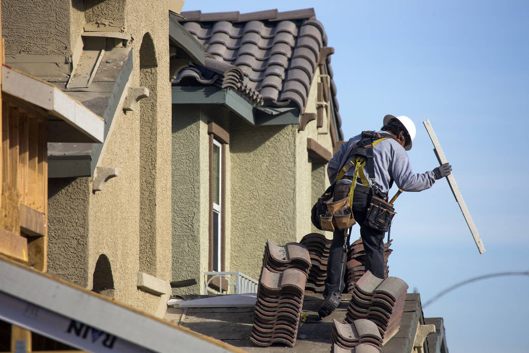A man works on a single family homes at Cadence, a 2,300-acre master planned community, in Henderson on Tuesday, Dec. 13, 2016. (Jeff Scheid/Las Vegas Review-Journal) Follow @jeffscheid