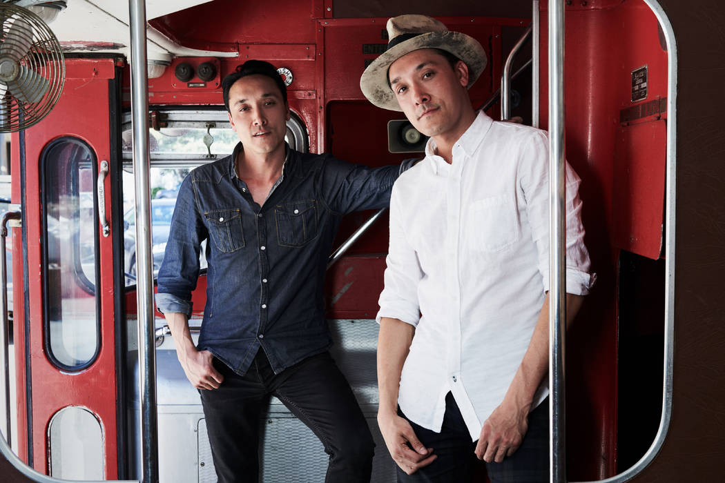 Jonnie and Mark Houston are shown on the 1963 Bristol Lodekka passenger bus being converted into a DJ booth for their new Strip nightspot, On The Record, set to open New Year's Eve at The Park MGM ...