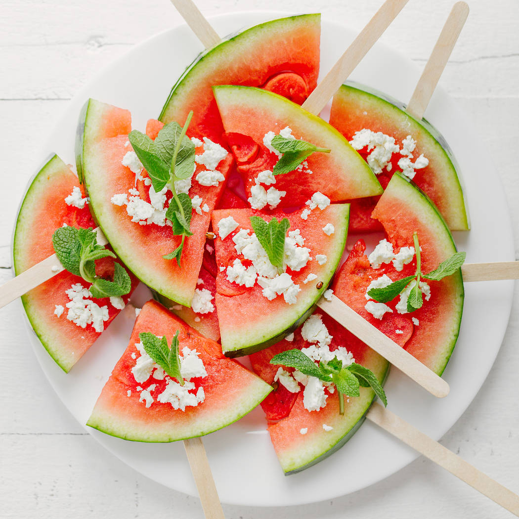 Watermelon on sticks topped with feta cheese and mint. Getty Images