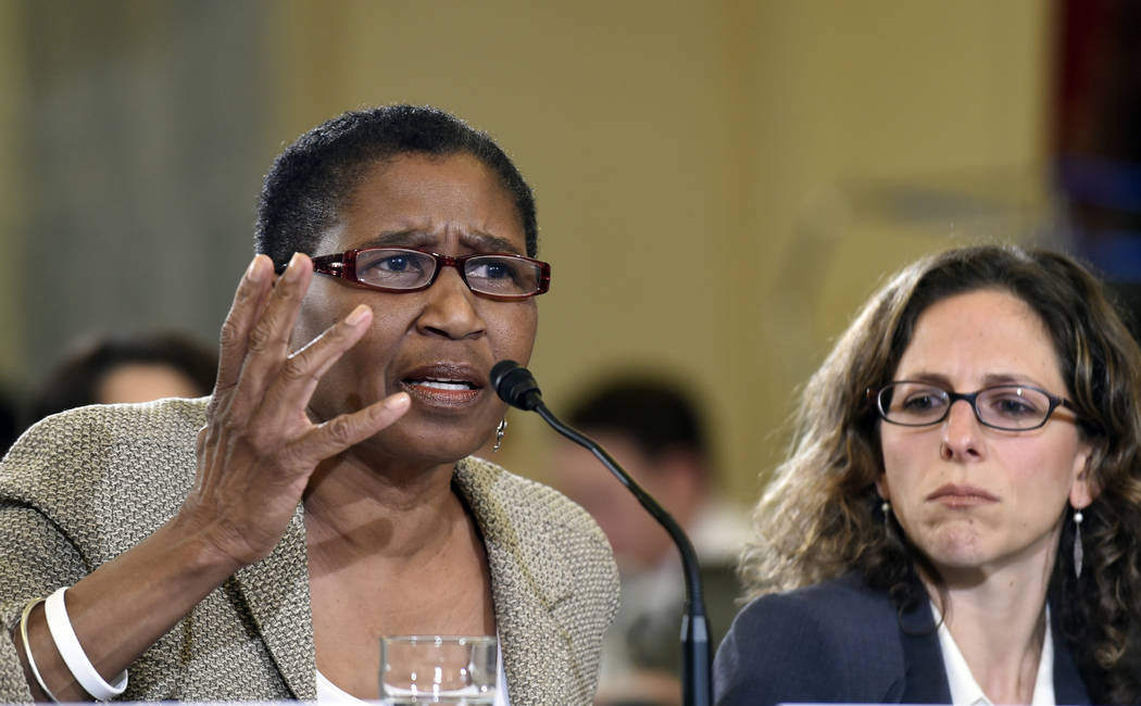 National Basketball Players Association Executive Director Michele Roberts, left, sitting next to National Hockey League Vice President and Deputy General Counsel Jessica Berman, testifies on Capi ...