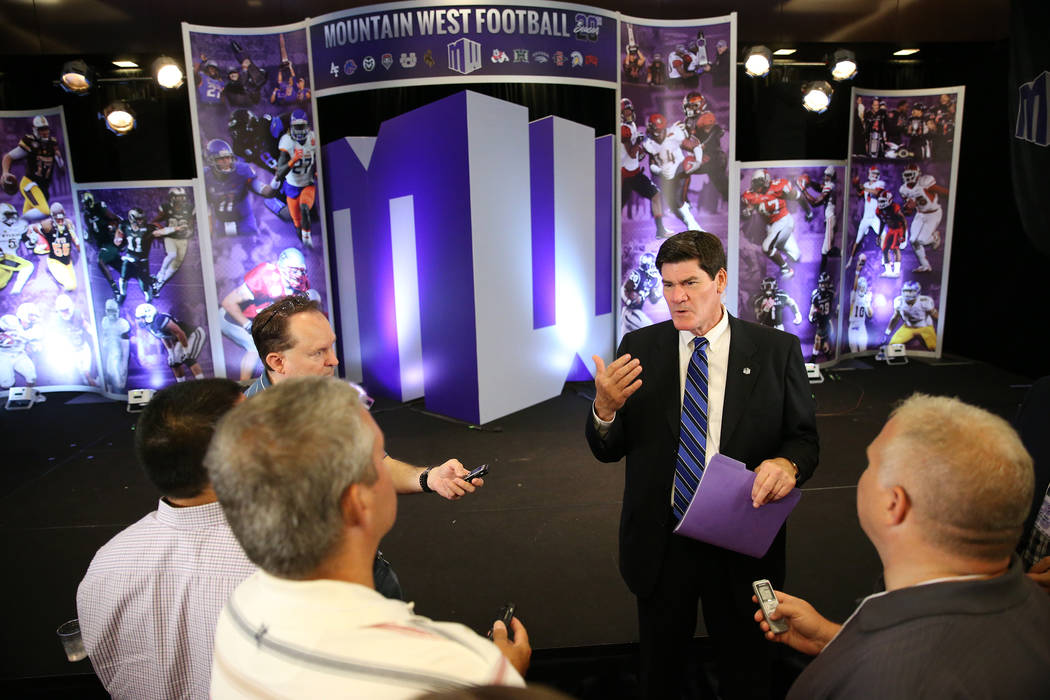 Commissioner Craig Thompson, center, is interviewed during the Mountain West Conference football media day at the Cosmopolitan hotel-casino in Las Vegas, Tuesday, July 24, 2018. Erik Verduzco Las ...