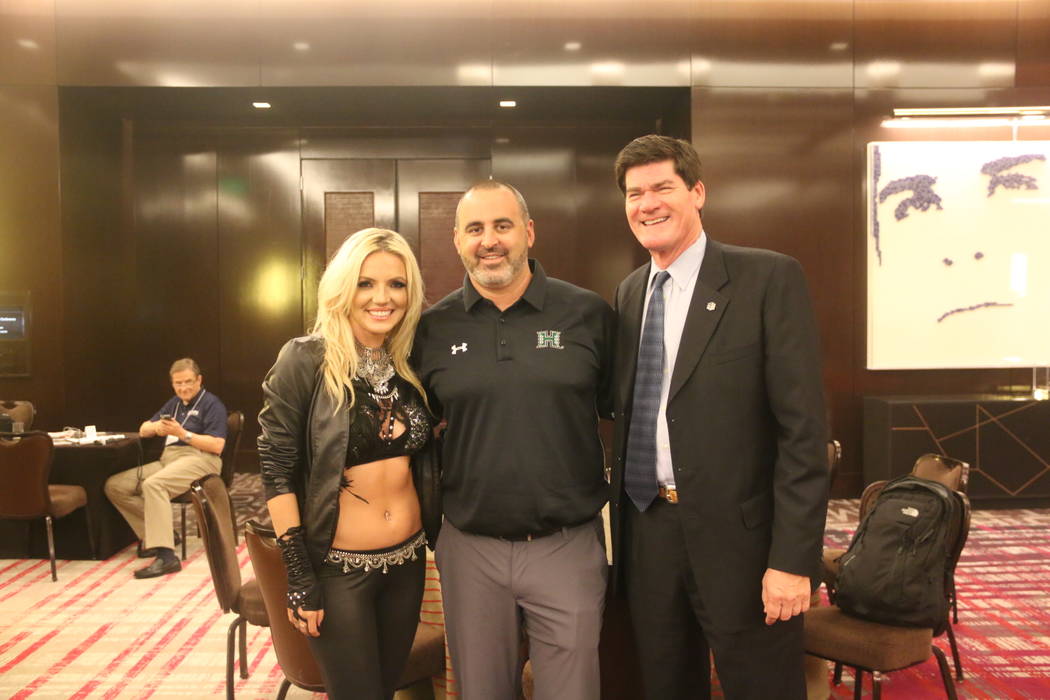 A Britney Spears impersonator poses with Hawaii football coach Nick Rolovich and Mountain West commissioner Craig Thompson on Wednesday at Mountain West media days at The Cosmopolitan of Las Vegas ...