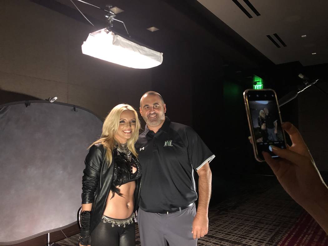 A Britney Spears impersonator poses with Hawaii football coach Nick Rolovich on Wednesday at Mountain West media days at The Cosmopolitan of Las Vegas. Photo courtesy of Hawaii Athletics.