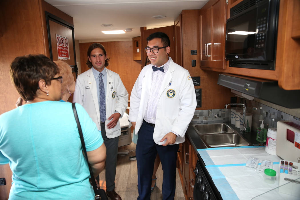Student doctors Daniel DeMers, left, and Jason Ma, show the new Touro University Nevada mobile healthcare clinic parked outside at City National Arena in Las Vegas, Thursday, July 19, 2018. Erik V ...