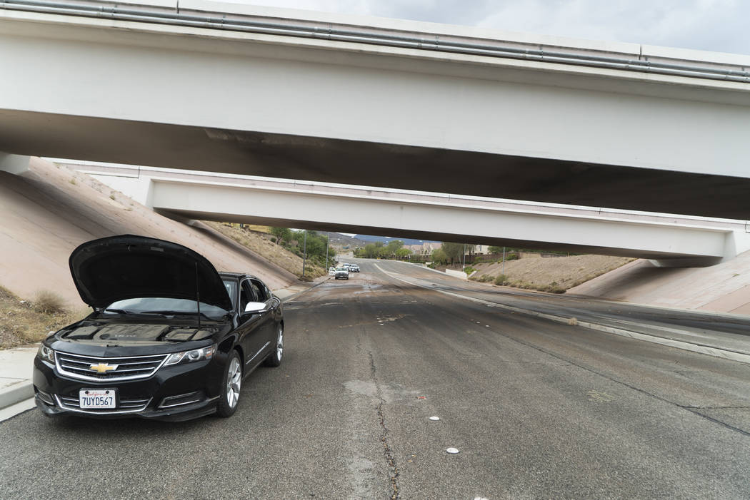 Car breaks down on Paradise Hills Drive under an Interstate 515/U.S. Highway 95 bridge due to flooding in Henderson, Thursday, July 12, 2018. (Marcus Villagran/Las Vegas Review-Journal) @brokejour ...
