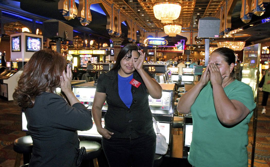 Sahara hotel-casino employees, from left, food and beverage manager Rebecca Santiago, server Ba ...