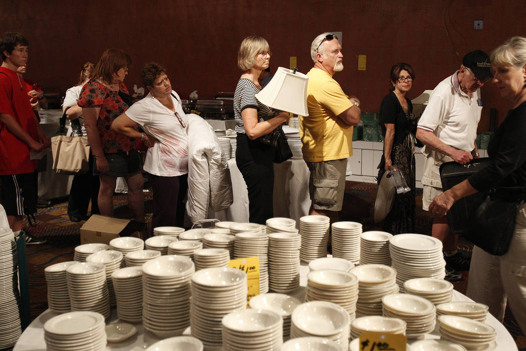People wait to buy items at a liquidation sale at the Sahara hotel-casino in June of 2011. (Las ...