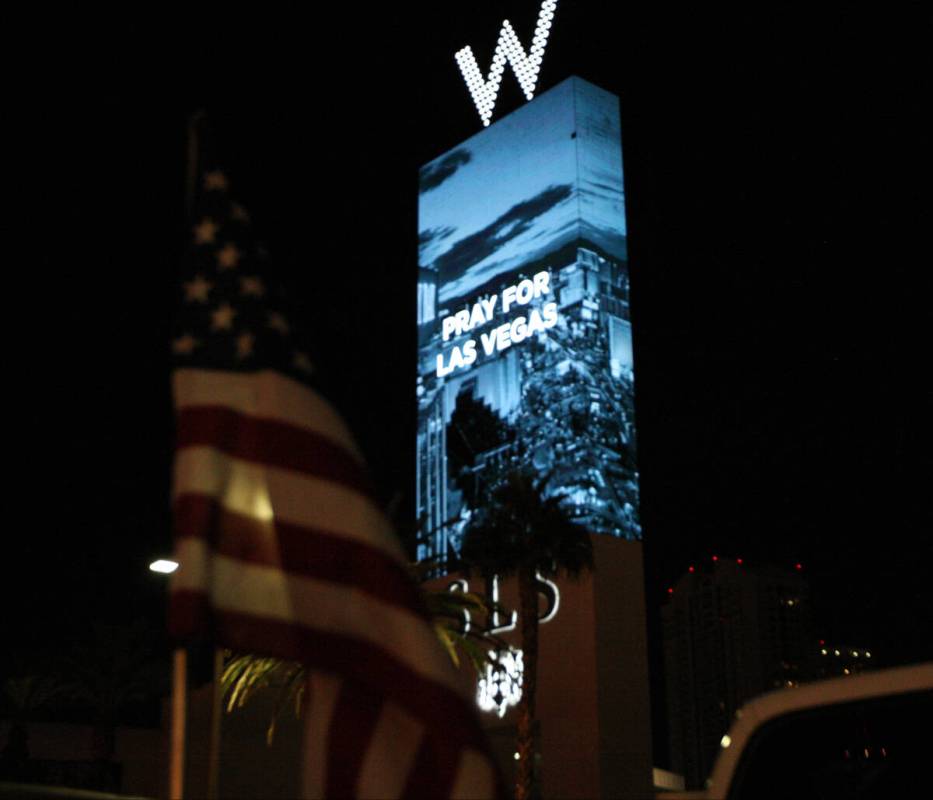 The sign outside the SLS Las Vegas hotel-casino reads, Pray for Las Vegas" near East Sahara Ave ...