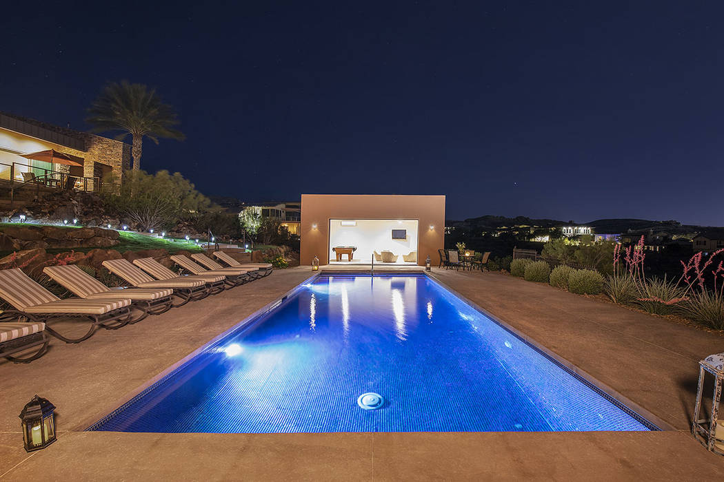 The pool house is at the end of the pool. (Synergy/Sotheby’s International Realty)
