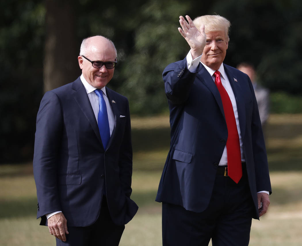 U.S. President Donald Trump leaves Winfield House, residence of the US Ambassador Woody Johnson, left, before boarding Marine One helicopter for the flight to Chequers, in Buckinghamshire, Friday, ...