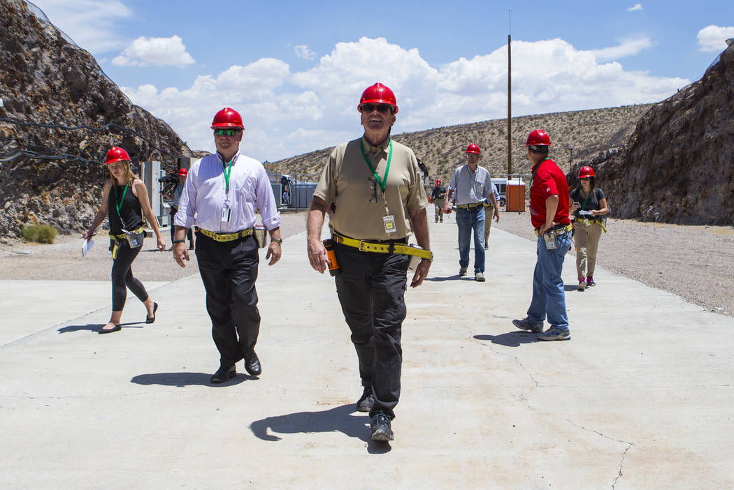U.S. Rep. Neal Dunn, R-Fla., center, heads to the south portal of Yucca Mountain during a congressional tour near Mercury on Saturday, July 14, 2018. Chase Stevens Las Vegas Review-Journal @csstev ...