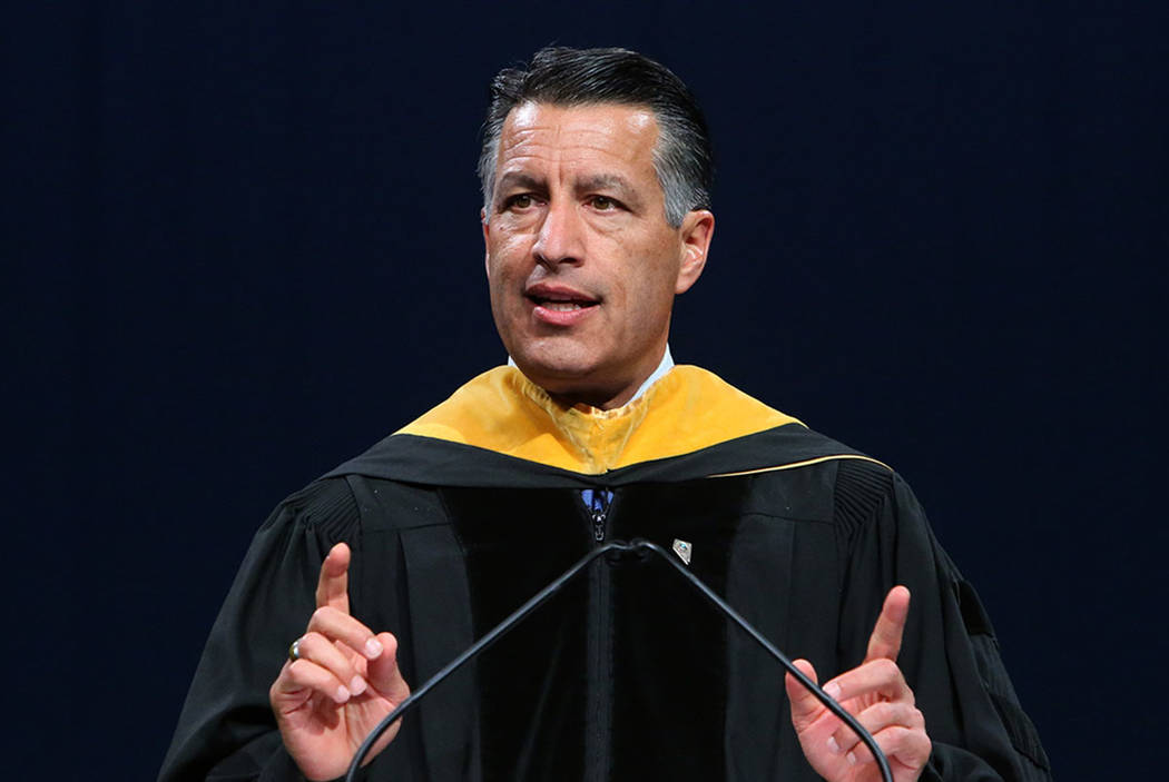 Gov. Brian Sandoval delivers remarks during the master's degree graduation ceremony of  Western Governors University of Nevada  at the Thomas & Mack Center on Saturday, June 2, 2018, in Las Vega ...