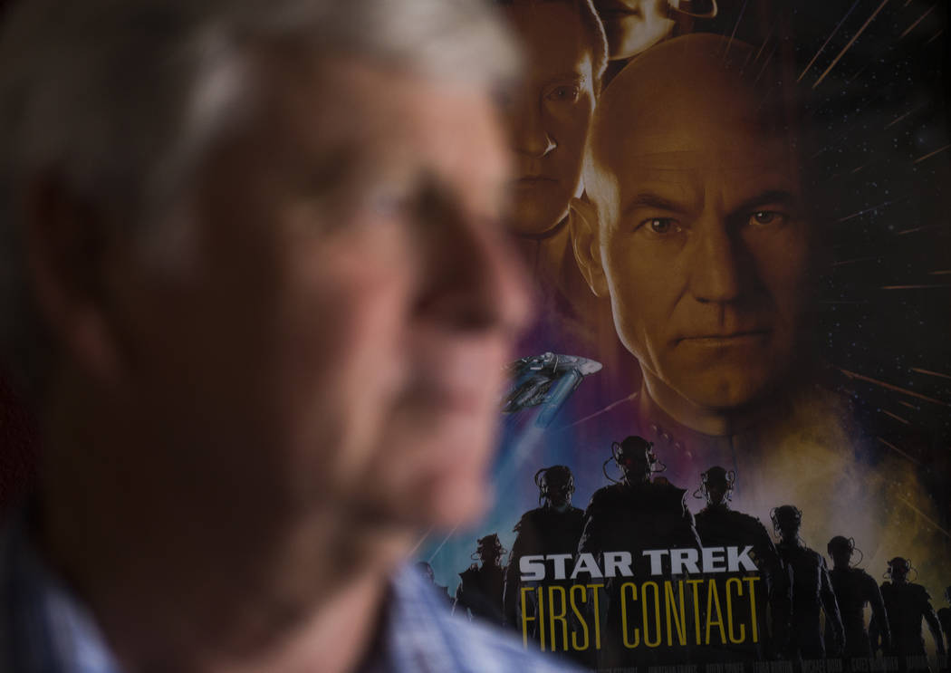 A Star Trek poster on the wall behind, Richard McGee, the conductor for the Nevada Pops orchestra, at his home in Las Vegas, Sunday, July 15, 2018. The Nevada Pops orchestra will play at the Star ...