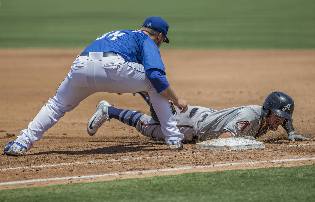 51s first baseman Peter Alonso (34) applies a tag during Las Vegas' home matchup with the Reno Aces on Sunday, June 24, 2018, at Cashman Field, in Las Vegas. Benjamin Hager Las Vegas Review-Journa ...