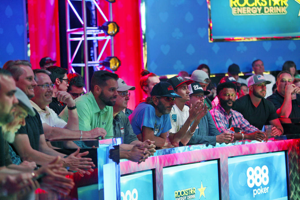 A large crowd watches the remaining three players Michael Dyer, John Cynn, and Tony Miles on day three at the World Series of Poker tournament of the main event final table at the Rio Convention C ...