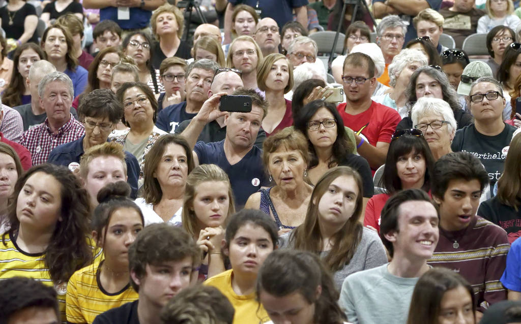 Audience members listen as students from Marjory Stoneman Douglas High School, the Parkland, Florida, school where 17 people were shot dead in February, speak during a town hall at the Mountain Am ...