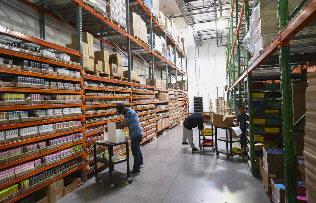 Employees retrieve items for online and wholesale orders at the eCig Distributors warehouse near McCarran International Airport in Las Vegas on Friday, July 13, 2018. Chase Stevens Las Vegas Revie ...