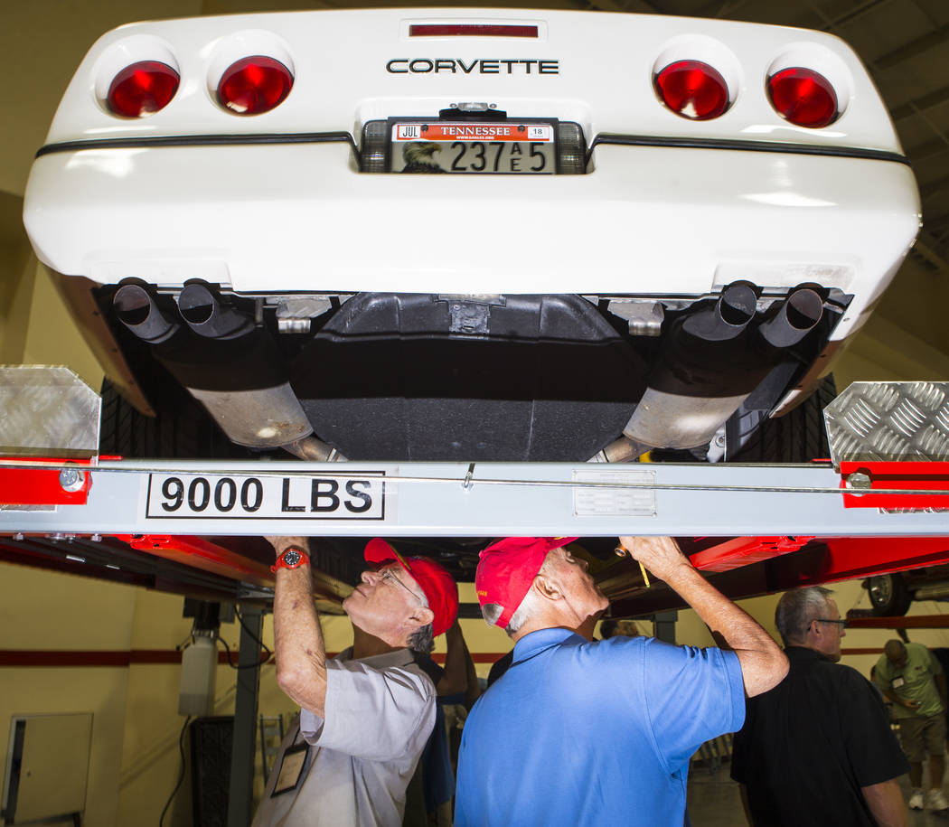 Don Troyer of Alhambra, Calif., left, and Ed Hoffman of Santa Clarita, Calif. inspect a 1988 Corvette during the National Corvette Restorers Society convention at the South Point in Las Vegas on T ...