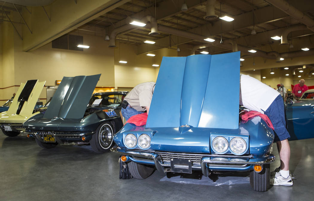 Attendees inspect a 1967 Corvette owned by Ray Geiger during the National Corvette Restorers Society convention at the South Point in Las Vegas on Tuesday, July 17, 2018. Chase Stevens Las Vegas R ...