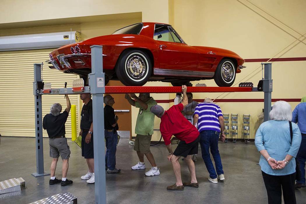 Attendees inspect a 1963 Corvette owned by Chris Moore during the National Corvette Restorers Society convention at the South Point in Las Vegas on Tuesday, July 17, 2018. Chase Stevens Las Vegas ...