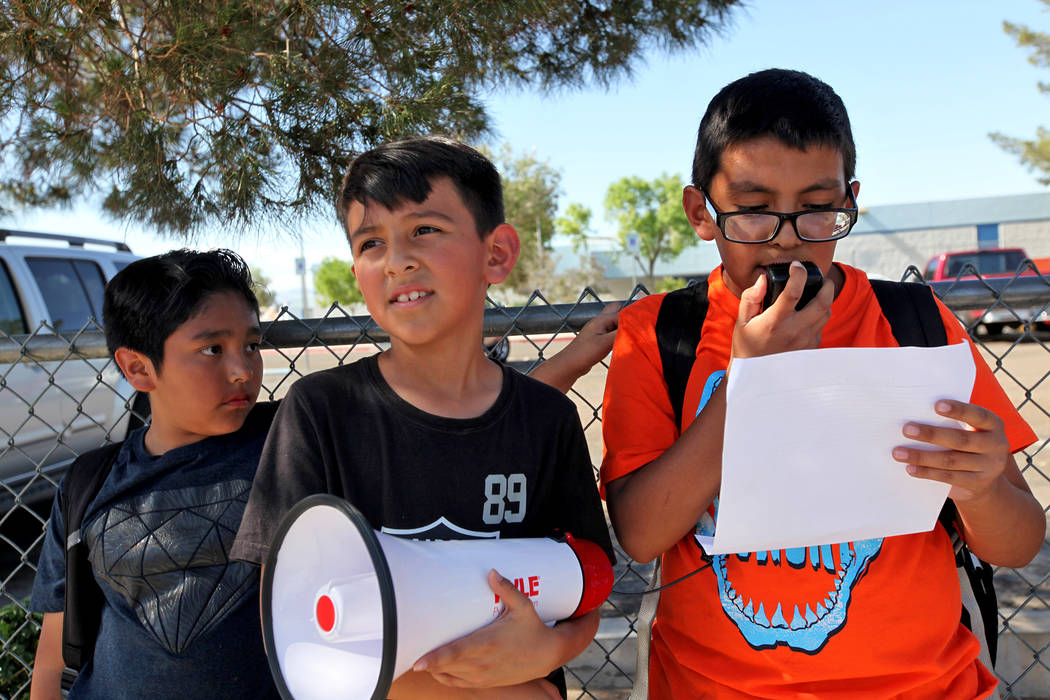 Benjamin Mijarez, 10, speaks about grievances over CCSD budget cuts and other issues as Diego Moreno, 10, from left, and Adrian Hinojosa, 9, listen during a town hall outside of Stanford Elementar ...