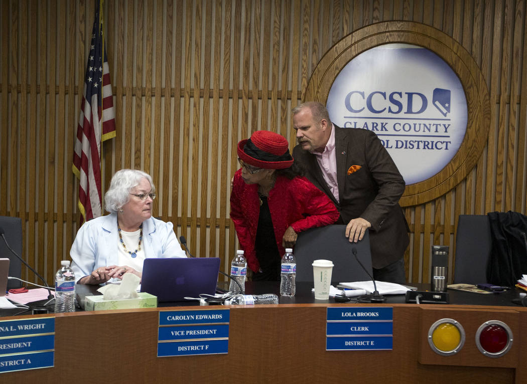 Clark County School District trustees Carolyn Edwards, left, argues with Dr. Linda E. Young as Kevin Child intervenes during a CCSD Board of Trustees meeting at CCSD's education center in Las Vega ...