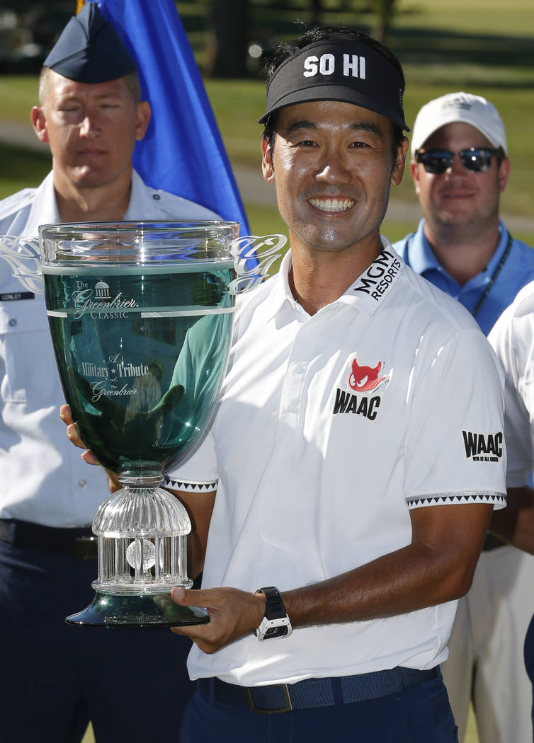 Kevin Na holds the trophy after winning the Military Tribute PGA Tour Golf Tournament at the Greenbrier in White Sulphur Springs, W. Va., Sunday, July 8, 2018. (AP Photo/Steve Helber)