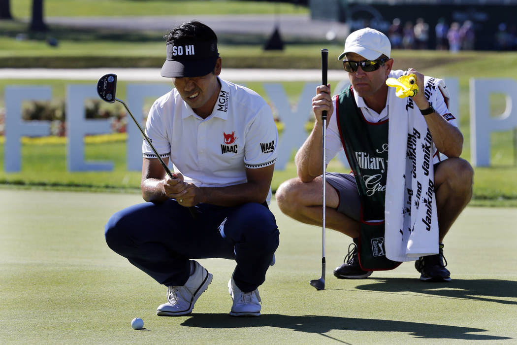 Kevin Na lines up a putt on the 18th hole with his caddie during the Military Tribute PGA Tour Golf Tournament at the Greenbrier in White Sulphur Springs, W. Va., Sunday, July 8, 2018. Na finished ...
