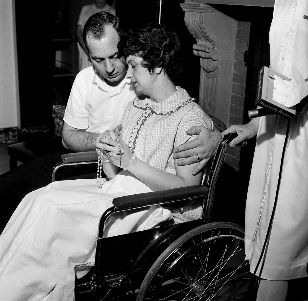Fingering the rosary, Dora and Chester Fronczak are pictured as they pray for the return of their kidnapped son in Chicago, April 30, 1964. The couple then conducted a press conference. The son, P ...