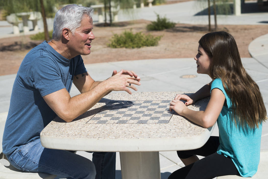 Paul Fronczak spends time with his daughter Emma at Paseo Vista Park in Henderson, Sunday, July 8, 2018. (Marcus Villagran/Las Vegas Review-Journal) @brokejournalist