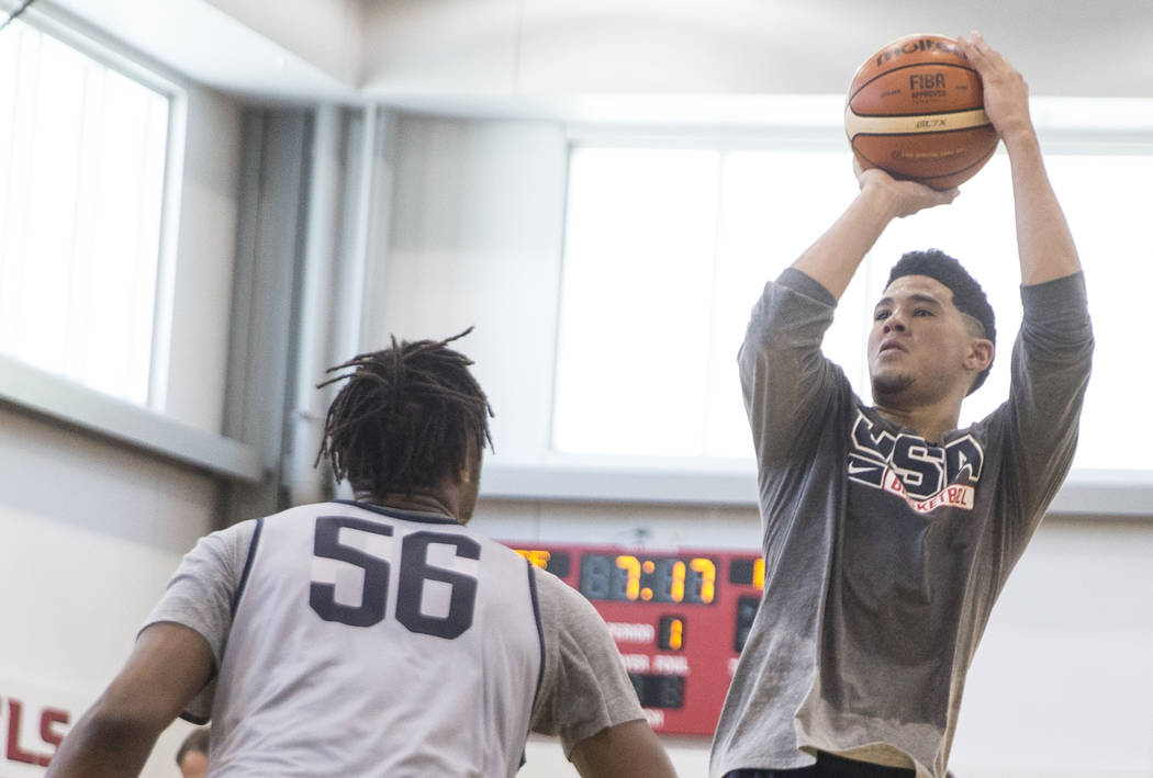 Phoenix Suns guard Devin Booker (31) shoots over Indiana Pacers center Miles Turner (56) during Team USA basketball's minicamp on Friday, July 27, 2018, at the Mendenhall Center, in Las Vegas. Ben ...