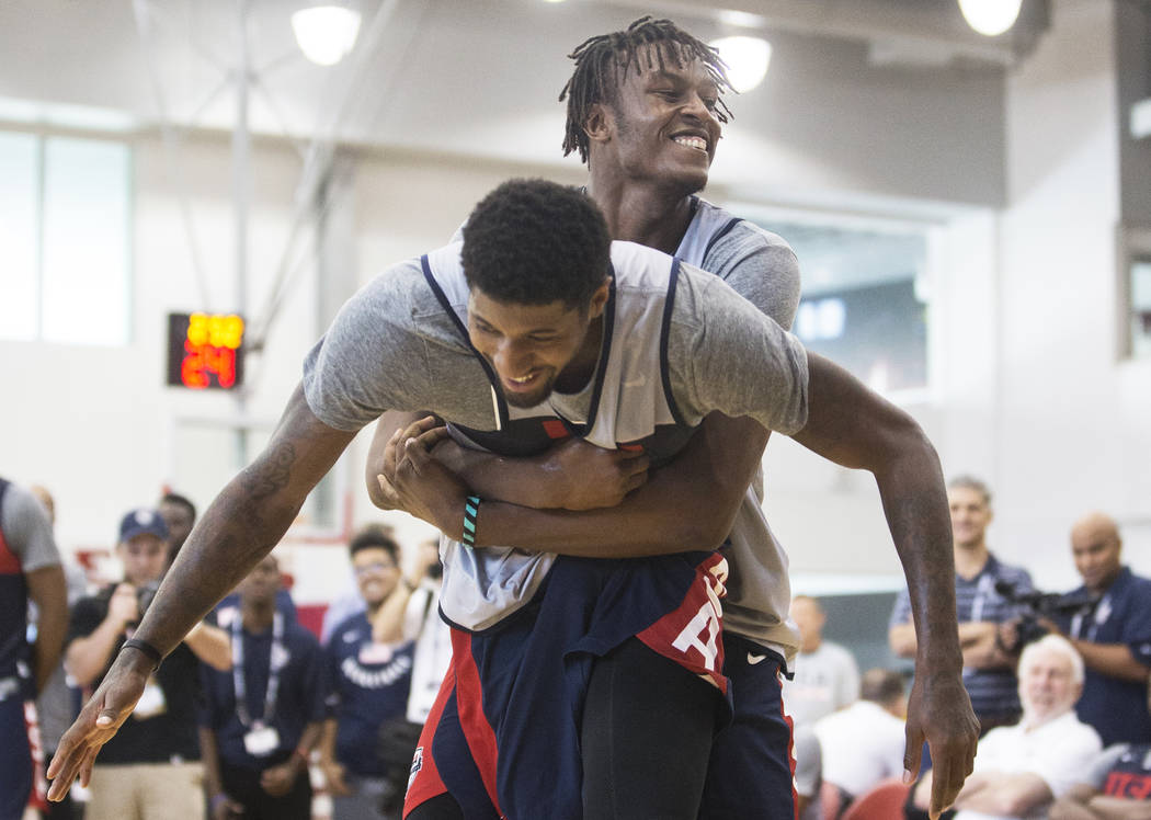 Indiana Pacers center Miles Turner (56) jokes around with Oklahoma City Thunder forward Paul George (39) during Team USA basketball's minicamp on Friday, July 27, 2018, at the Mendenhall Center, i ...