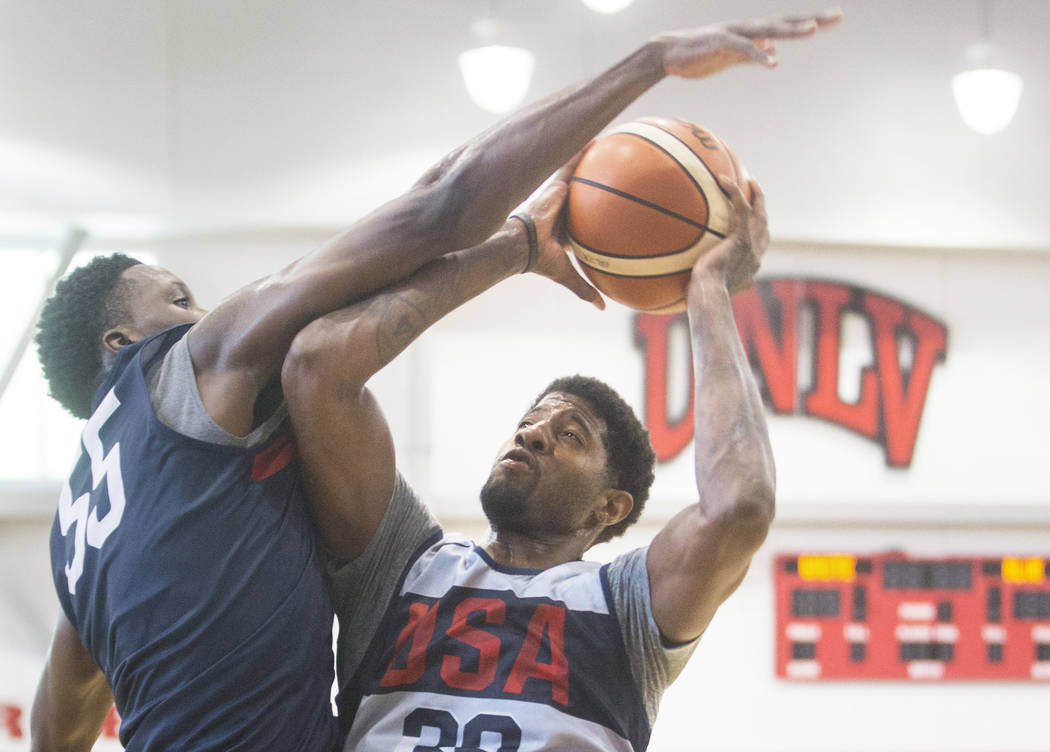 Oklahoma City Thunder forward Paul George (39) drives baseline on Indiana Pacers guard Victor Oladipo (55) during Team USA basketball's minicamp on Friday, July 27, 2018, at the Mendenhall Center, ...