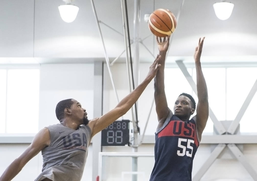 Indiana Pacers guard Victor Oladipo (55) shoots over Golden State Warriors guard Kevin Durant (52) during Team USA basketball's minicamp on Friday, July 27, 2018, at the Mendenhall Center, in Las ...