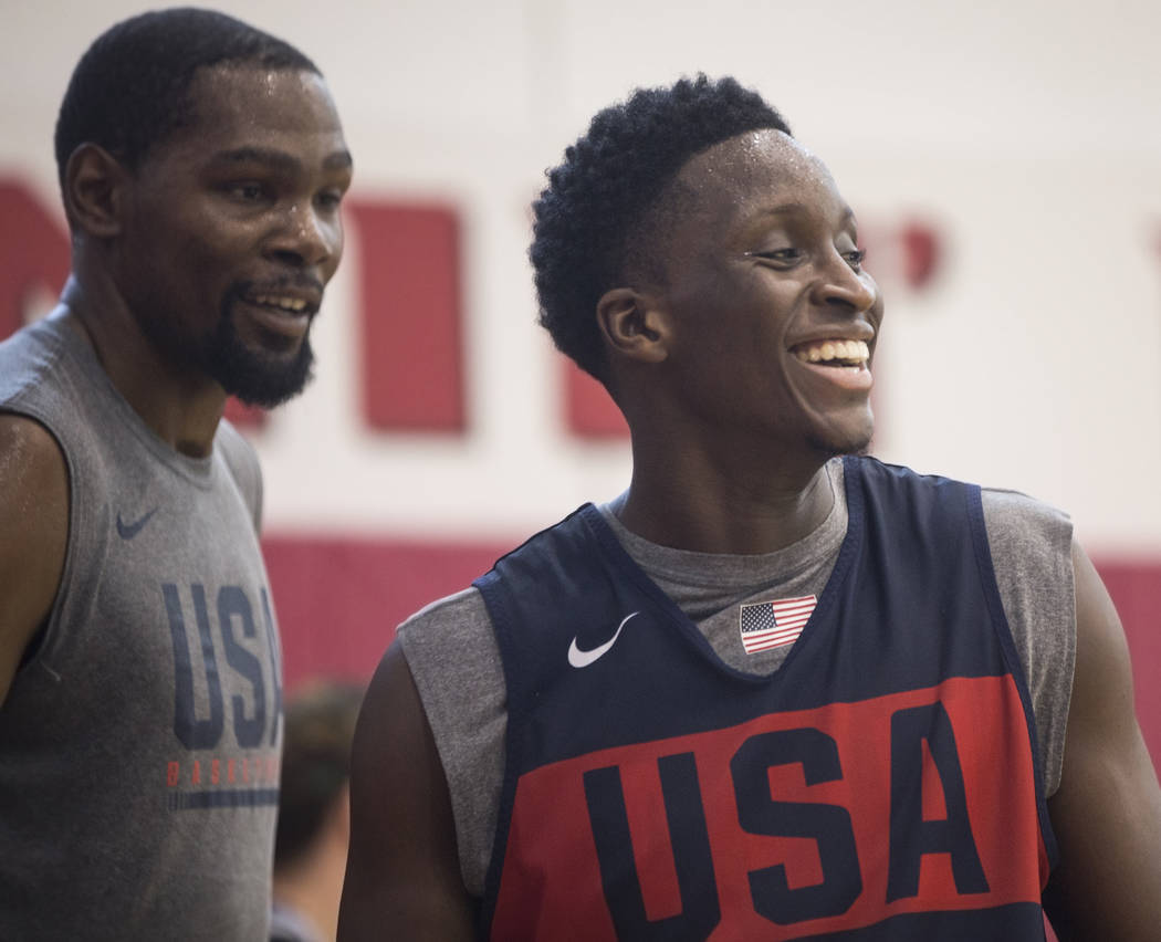 Indiana Pacers guard Victor Oladipo (55) and Golden State Warriors guard Kevin Durant (52) joke around during Team USA basketball's minicamp on Friday, July 27, 2018, at the Mendenhall Center, in ...