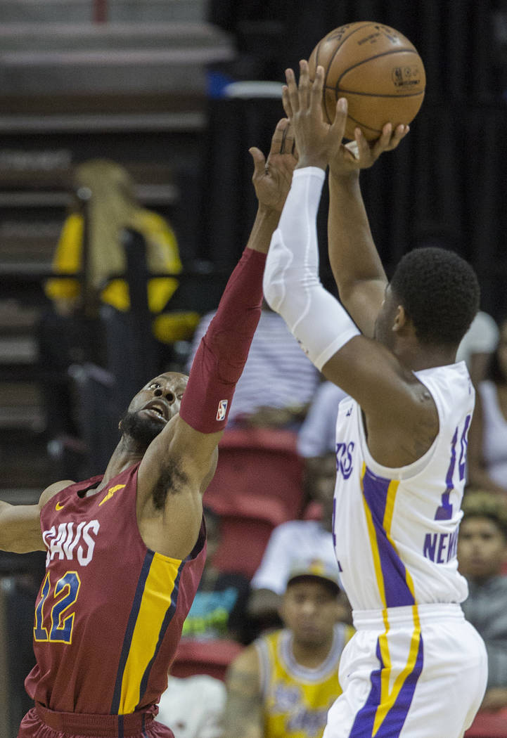 Cleveland Cavaliers guard Scoochie Smith (12) defends Los Angeles Lakers guard Malik Newman (14) in the first quarter during the NBA Summer League semifinals on Monday, July 16, 2018, at the Thoma ...