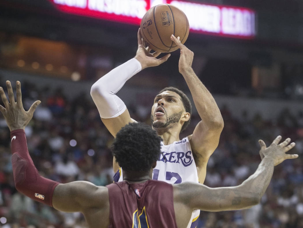 Los Angeles Lakers forward Jeff Ayres (12) shoots over Cleveland Cavaliers forward Jamel Artis (4) in the fourth quarter during the NBA Summer League semifinals on Monday, July 16, 2018, at the Th ...