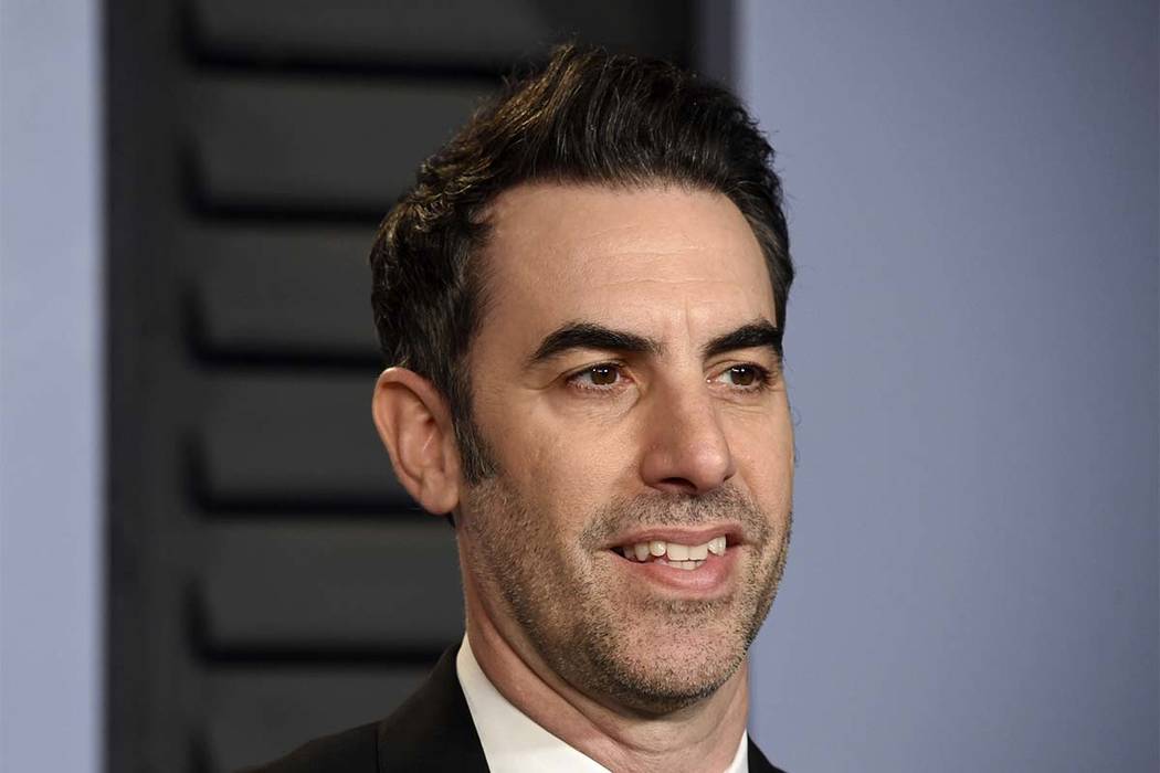 n this March 4, 2018 file photo, Sacha Baron Cohen arrives at the Vanity Fair Oscar Party in Beverly Hills, California. Cohen stars in the new Showtime series "Who Is America?" (Evan Agostini/Invi ...