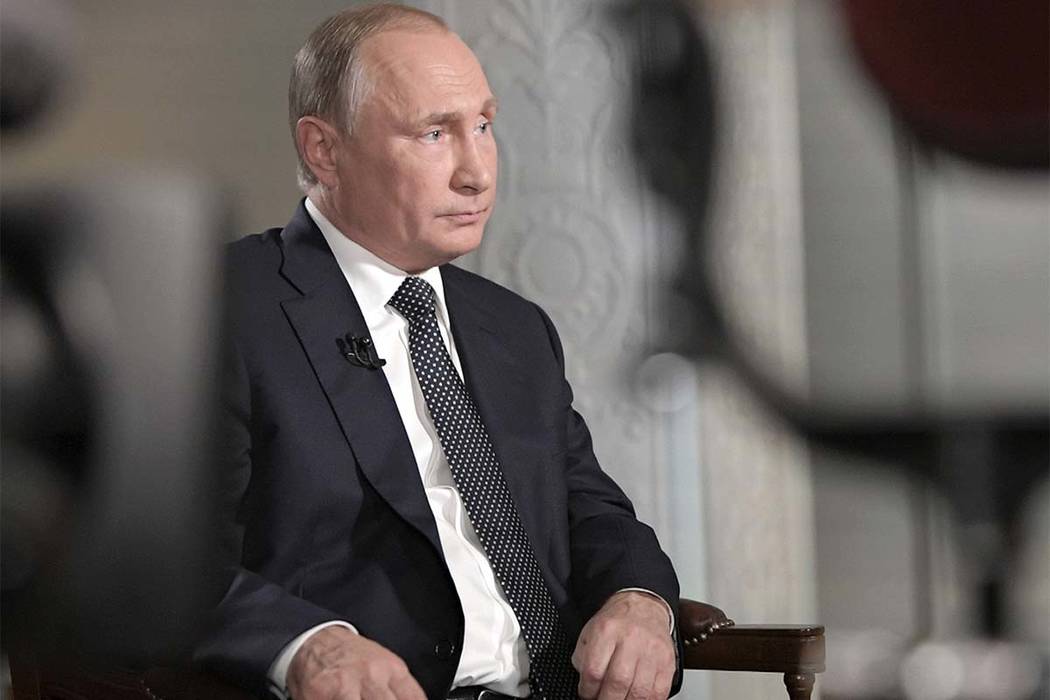 Russian President Vladimir Putin gestures during an interview with "Fox News Sunday" host Chris Wallace after his meeting with President Donald Trump in Helsinki, Finland, Monday, July 16, 2018. ( ...