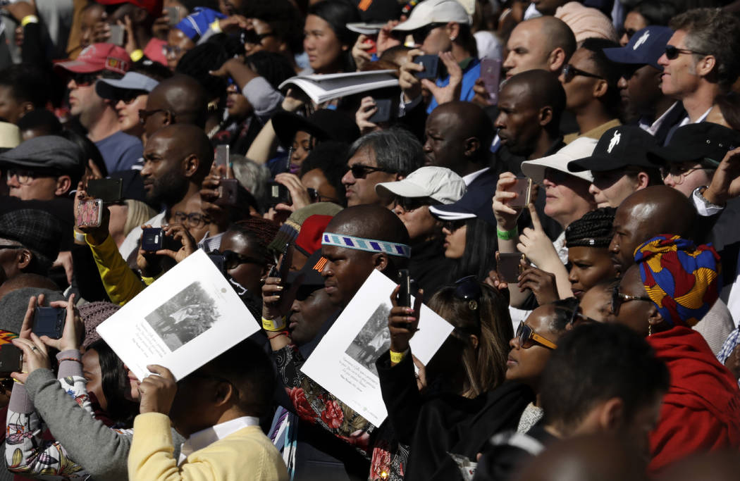 Crowds attend the 16th Annual Nelson Mandela Lecture at the Wanderers Stadium in Johannesburg, South Africa, Tuesday, July 17, 2018 where former President Barack Obama was to deliver the 16th Annu ...